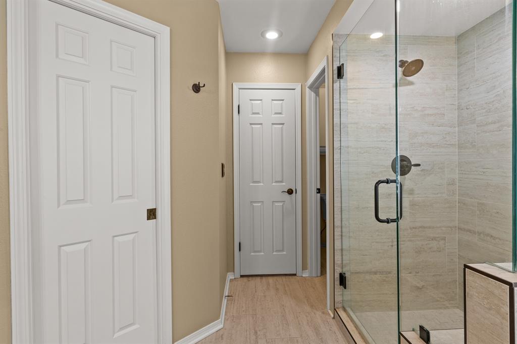 78 County Road 2137 Pittsburg, TX 75686 - Photo 24 of 40 a bathroom with a glass shower door