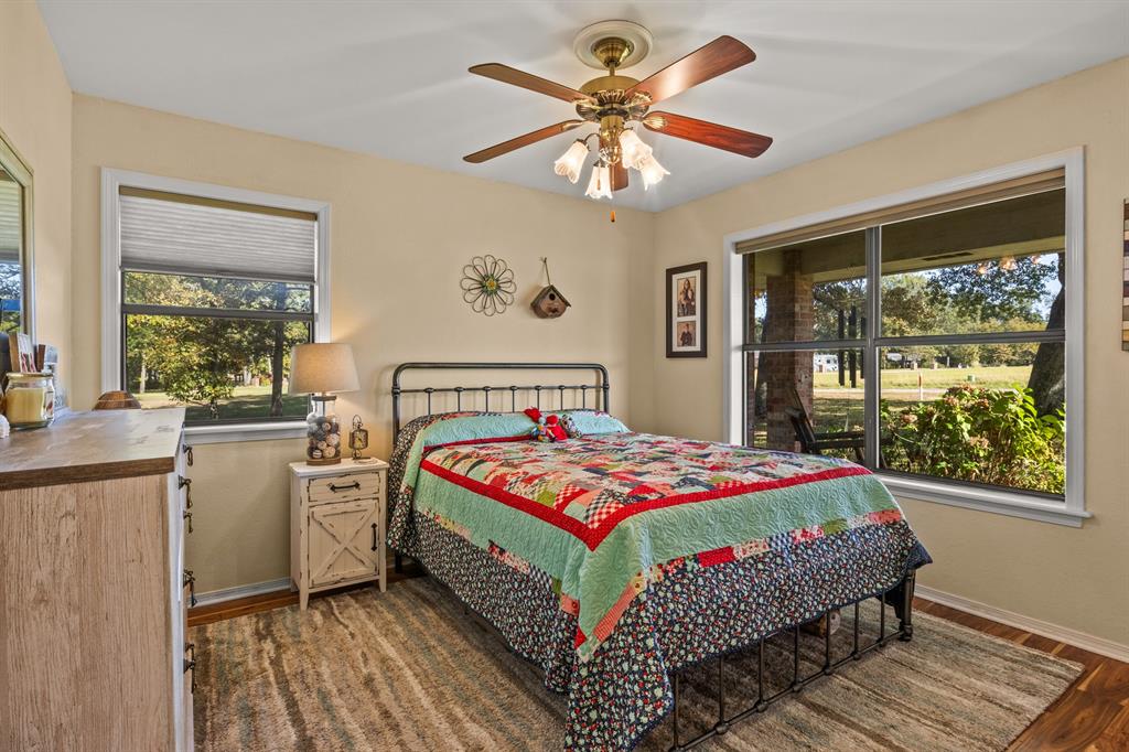 78 County Road 2137 Pittsburg, TX 75686 - Photo 26 of 40 a bedroom with a bed and a large window