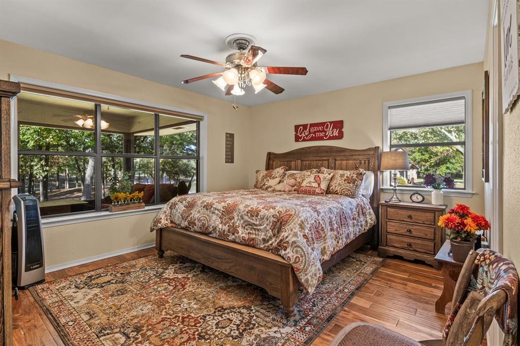 78 County Road 2137 Pittsburg, TX 75686 - Photo 28 of 40 a bedroom with a large bed and a window