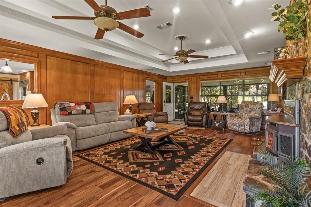 78 County Road 2137 Pittsburg, TX 75686 - Photo 7 of 40 a living room with lots of furniture and a large window