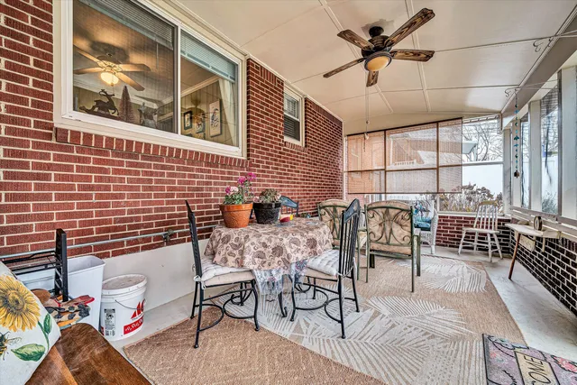 a view of a livingroom with furniture and window