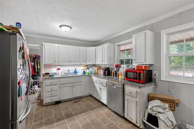 a dining room with furniture and window
