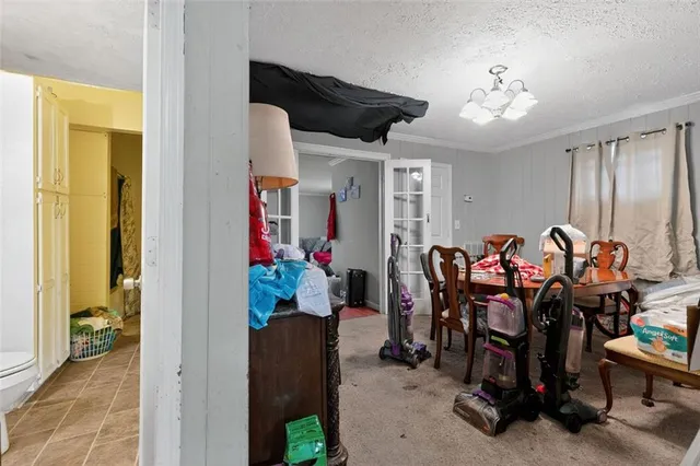 a living room with furniture and a lamp
