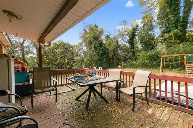 a view of a chairs and table in the balcony