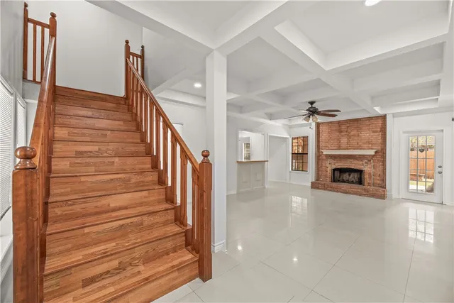 a view of a livingroom with wooden floor and fireplace