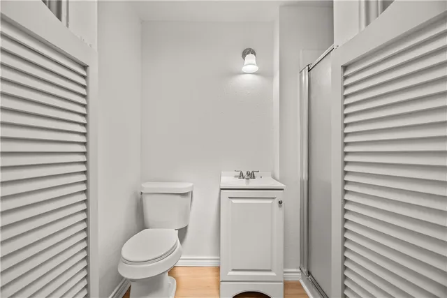 a bathroom with a toilet a sink and view