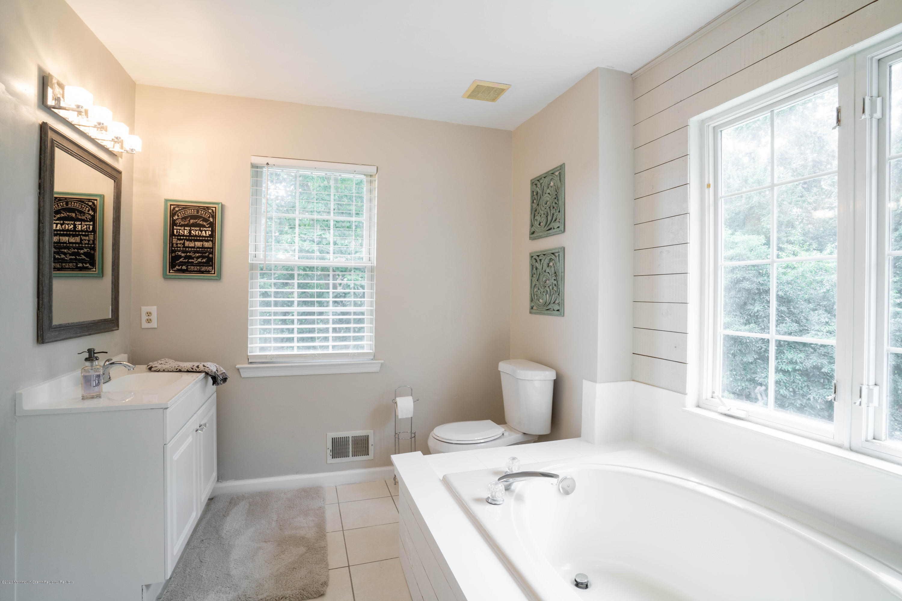 2 Sun Hollow Road Howell, NJ 07731 - Photo 22 of 34 a bathroom with a tub sink and mirror