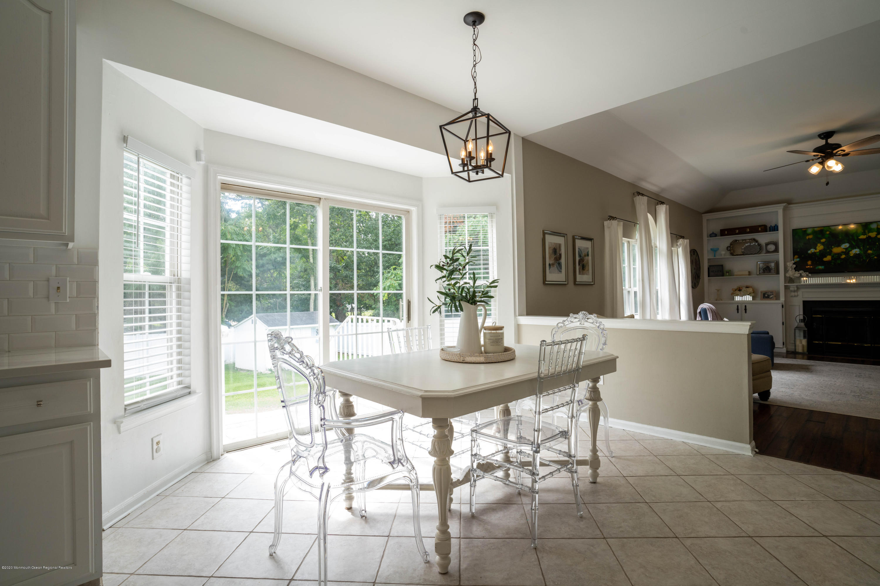 2 Sun Hollow Road Howell, NJ 07731 - Photo 7 of 34 a view of a dining room and a kitchen with a chandelier