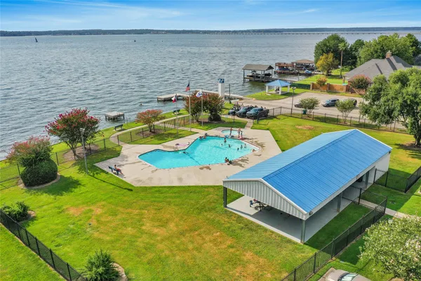 a view of a swimming pool with an outdoor seating and yard