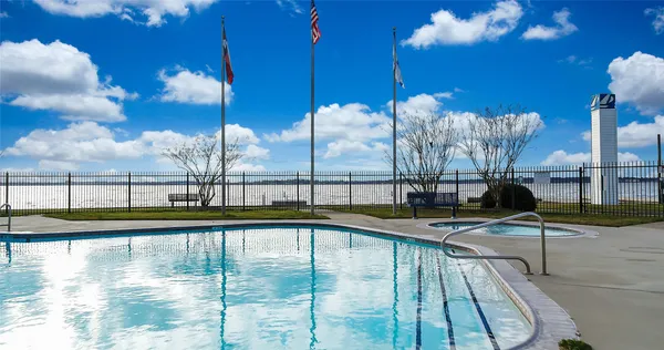 a view of swimming pool with outdoor seating