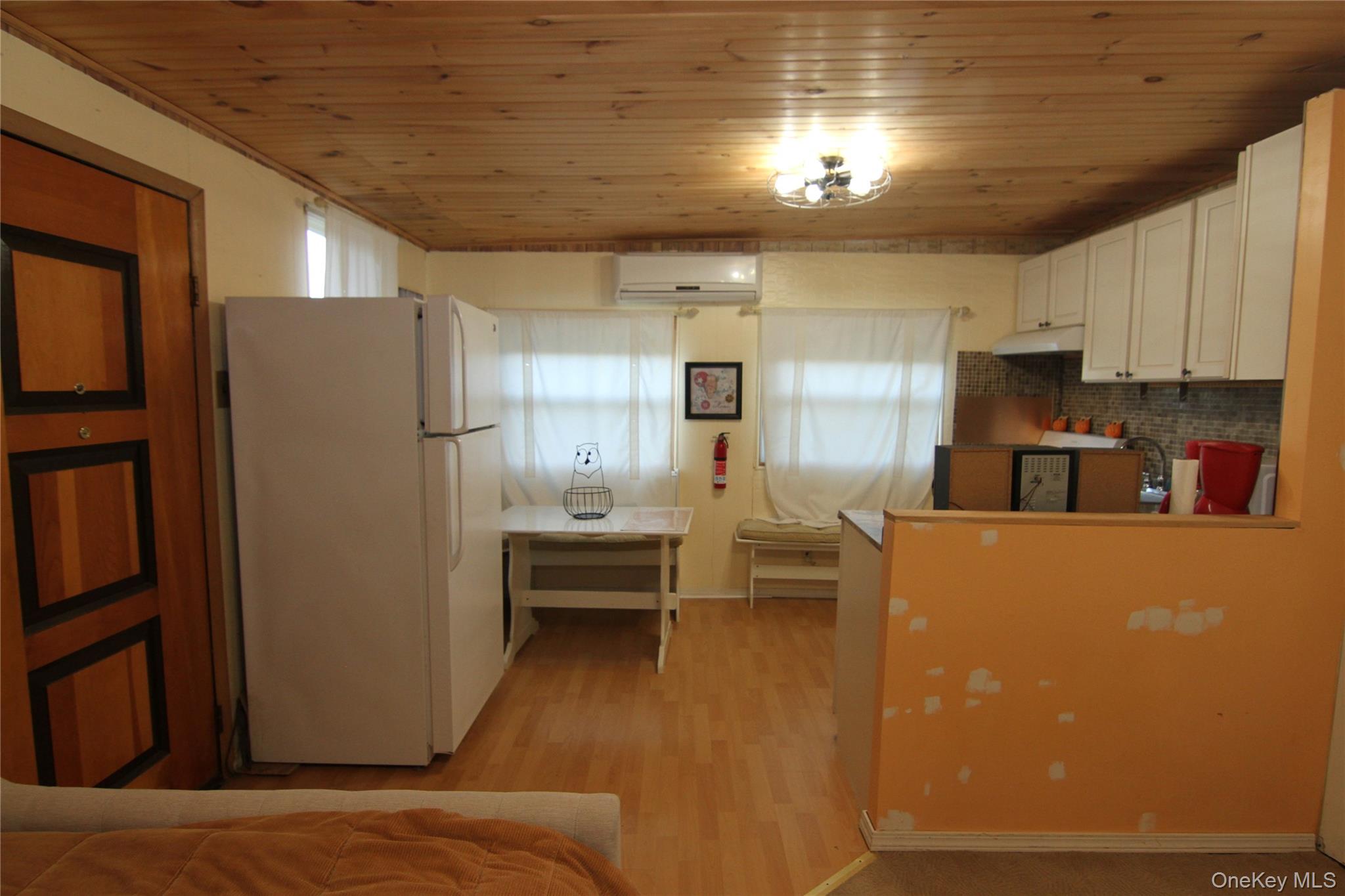 191 Sylvan Lake Road, Unit 16 Hopewell Junction, NY 12533 - Photo 16 of 34 a kitchen with stainless steel appliances refrigerator stove microwave and cabinets