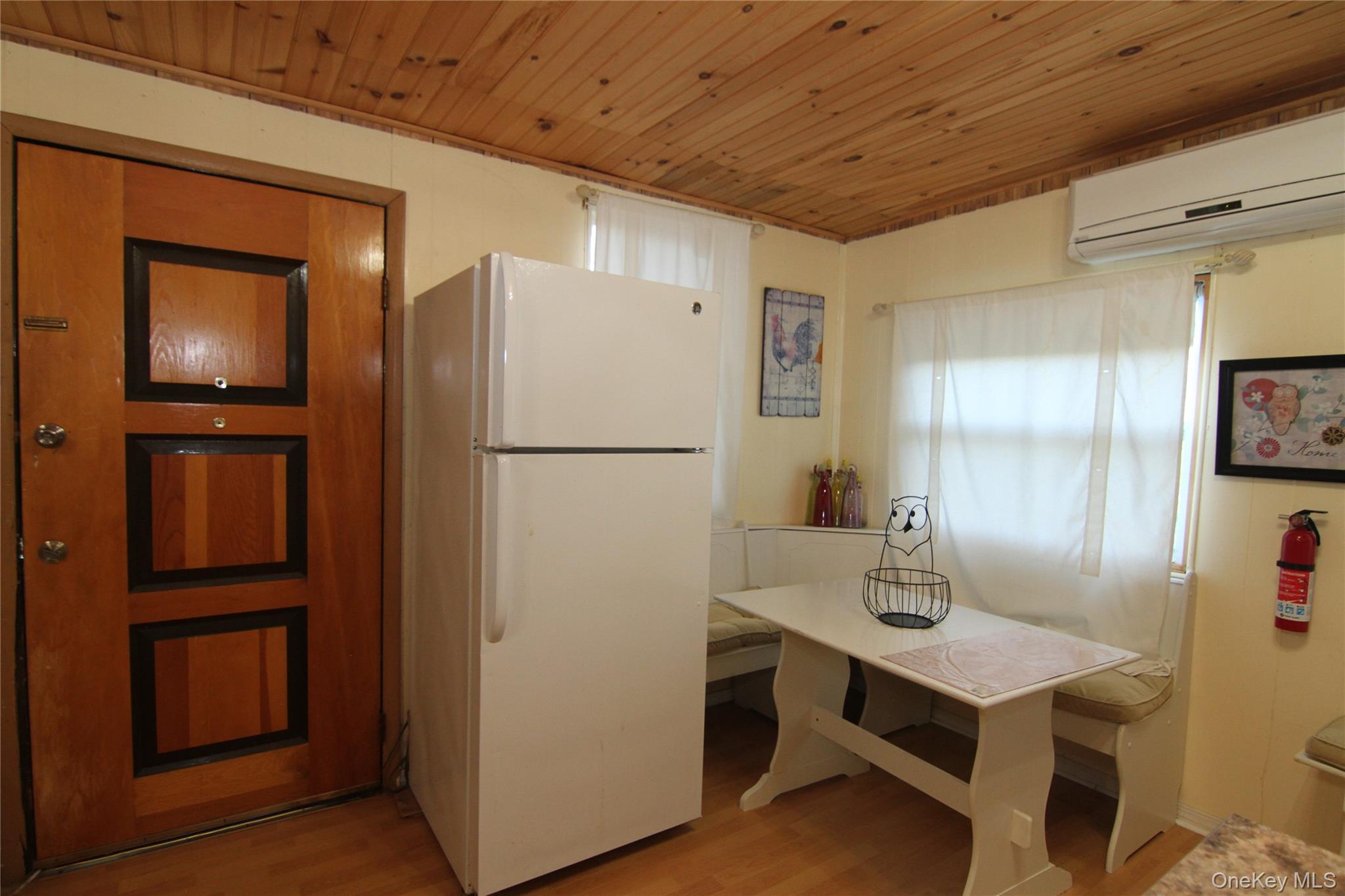 191 Sylvan Lake Road, Unit 16 Hopewell Junction, NY 12533 - Photo 17 of 34 a kitchen with refrigerator and cabinets