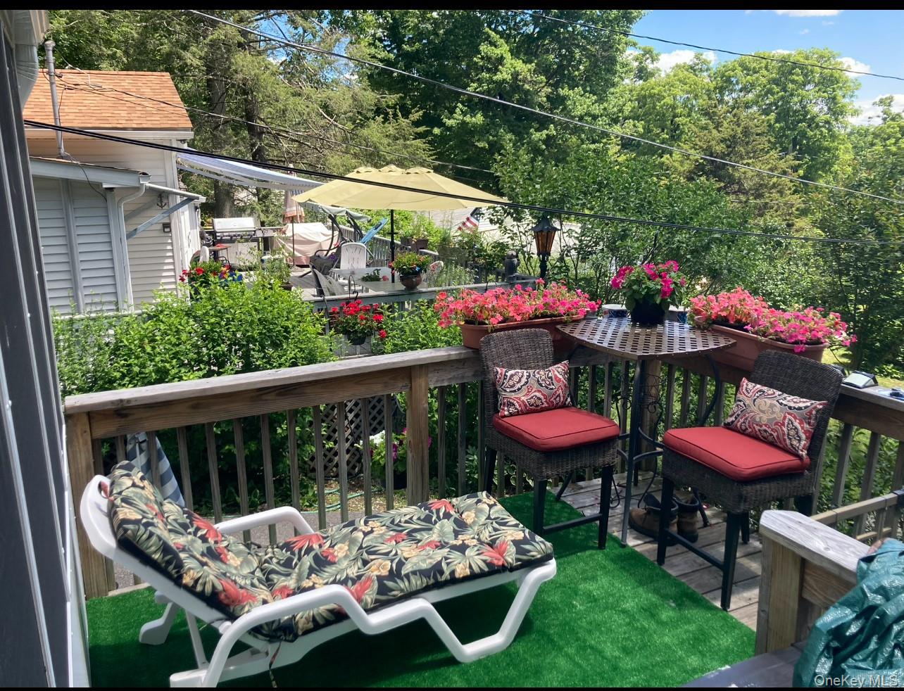 191 Sylvan Lake Road, Unit 16 Hopewell Junction, NY 12533 - Photo 2 of 34 a view of a chairs and tables in patio next to a yard