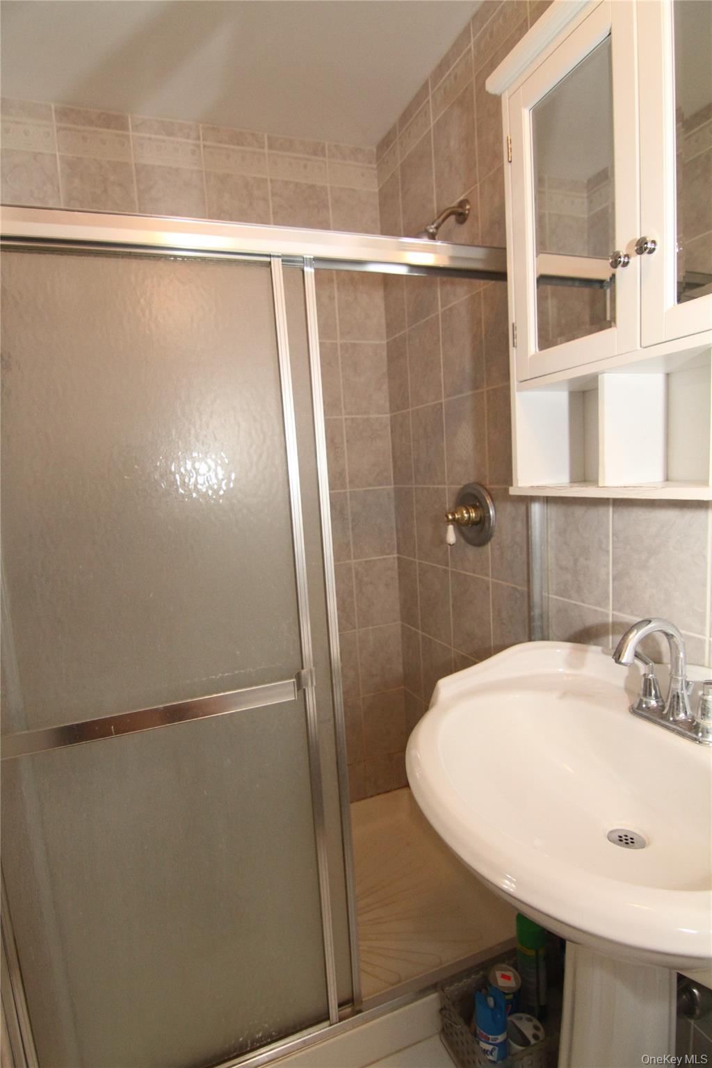 191 Sylvan Lake Road, Unit 16 Hopewell Junction, NY 12533 - Photo 23 of 34 a bathroom with a sink and mirror