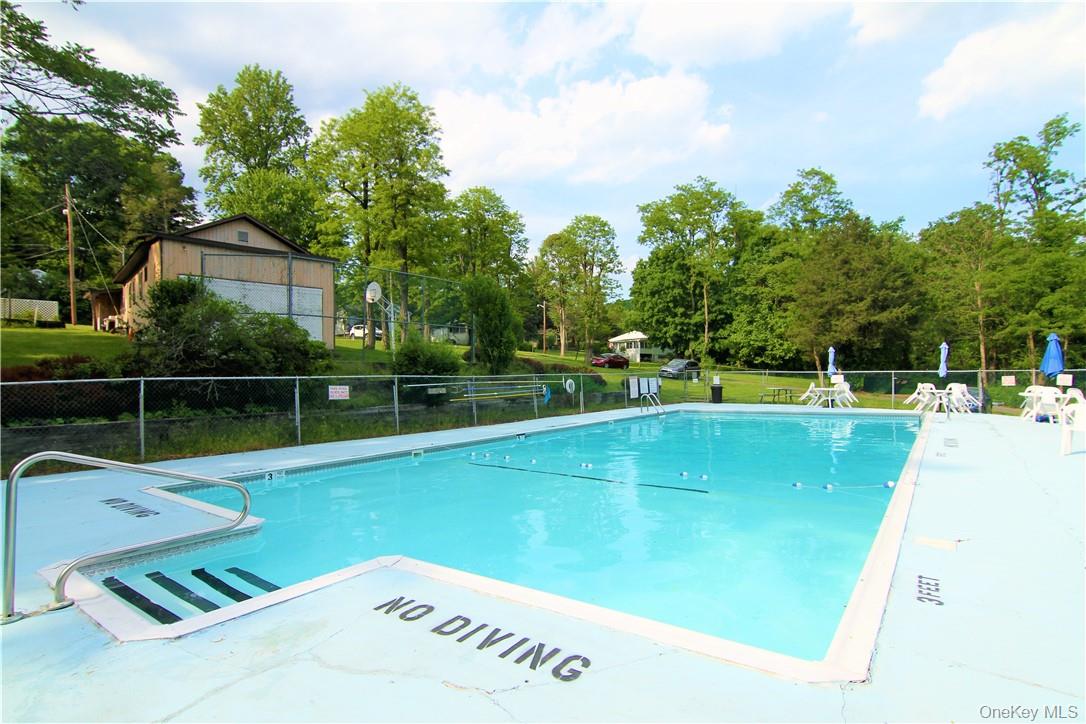 191 Sylvan Lake Road, Unit 16 Hopewell Junction, NY 12533 - Photo 29 of 34 a view of a tennis court