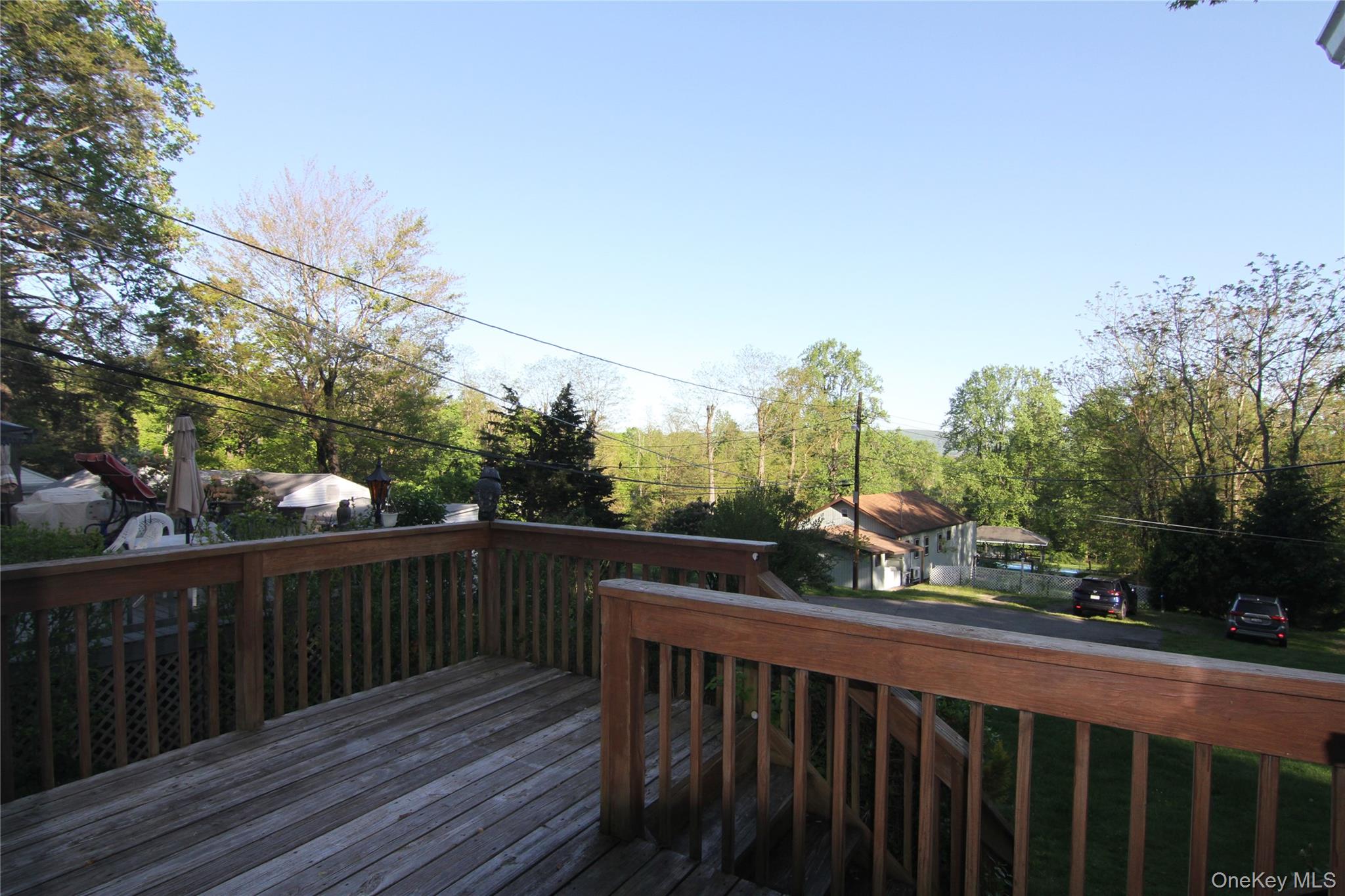 191 Sylvan Lake Road, Unit 16 Hopewell Junction, NY 12533 - Photo 3 of 34 a view of a balcony with wooden fence and floor