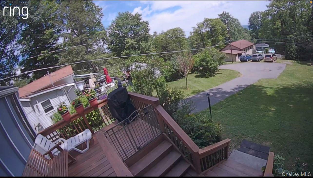 191 Sylvan Lake Road, Unit 16 Hopewell Junction, NY 12533 - Photo 6 of 34 a view of a chairs and table in the back yard