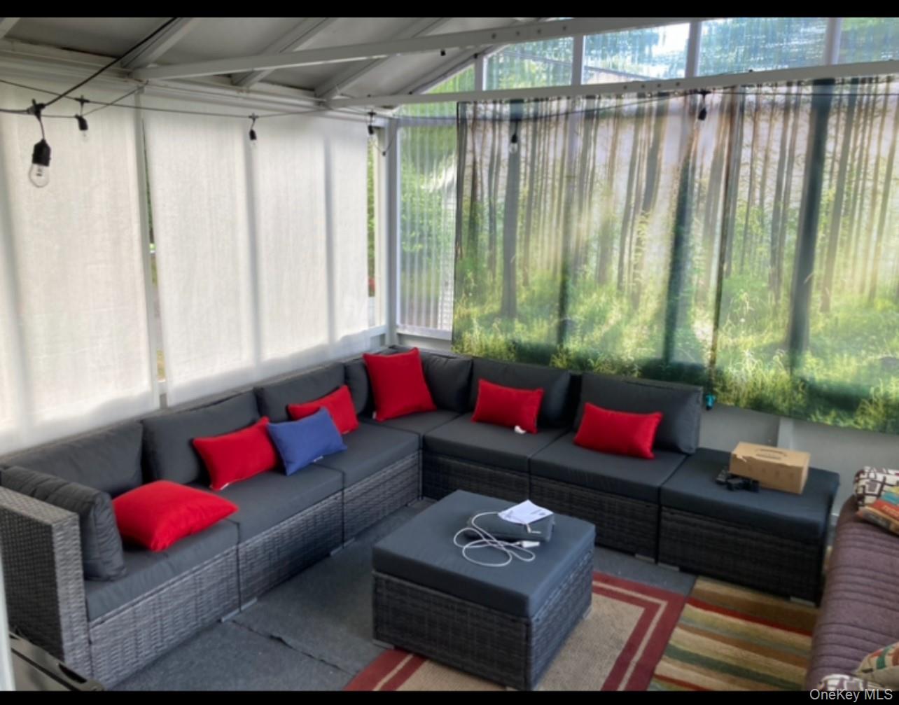 191 Sylvan Lake Road, Unit 16 Hopewell Junction, NY 12533 - Photo 7 of 34 a living room with furniture and a window