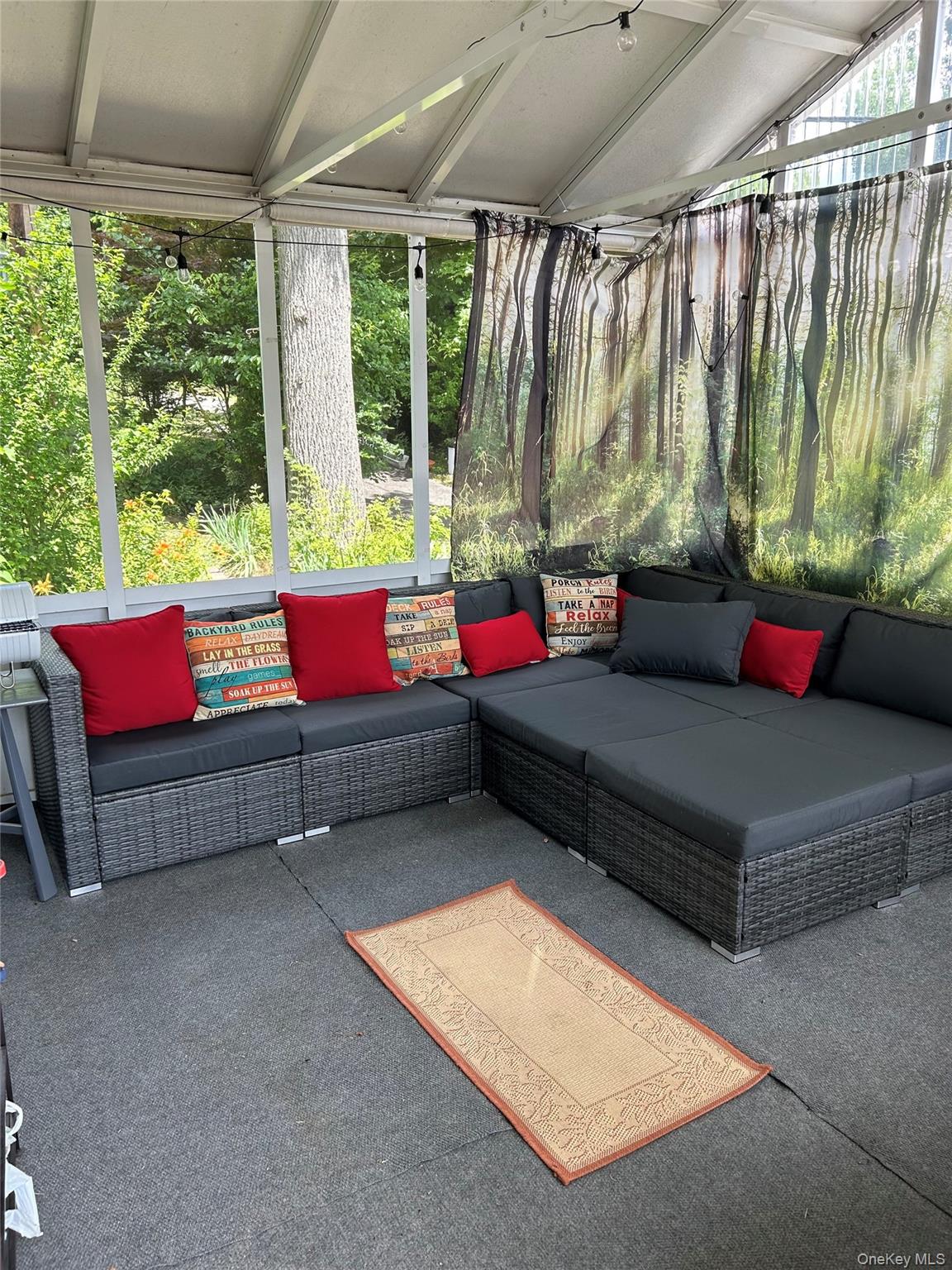 191 Sylvan Lake Road, Unit 16 Hopewell Junction, NY 12533 - Photo 8 of 34 a living room with yard and outdoor seating