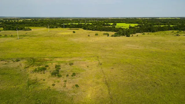 a view of a swimming pool with an outdoor seating and yard