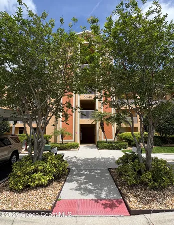 a view of a chairs and table in patio