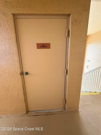 a living room with furniture and a book shelf