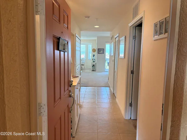 a kitchen with stainless steel appliances refrigerator and microwave