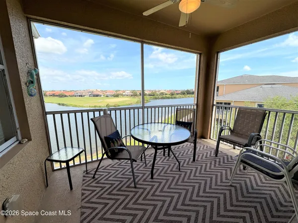 a large white kitchen with lots of counter space a sink and appliances