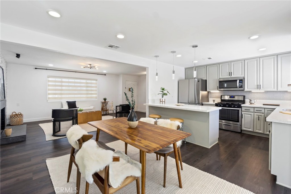 6212 Santa Rita Avenue Garden Grove, CA 92845 - Photo 12 of 50 a view of a dining room with furniture and wooden floor