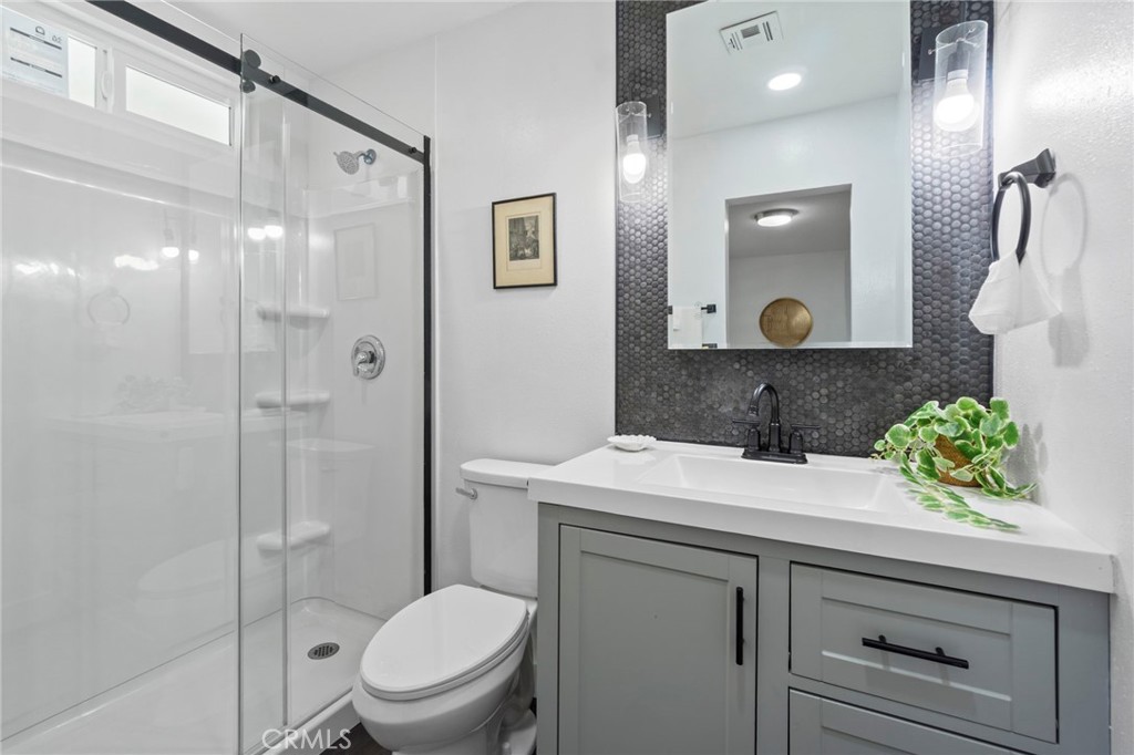 6212 Santa Rita Avenue Garden Grove, CA 92845 - Photo 23 of 50 a bathroom with a sink a toilet and shower