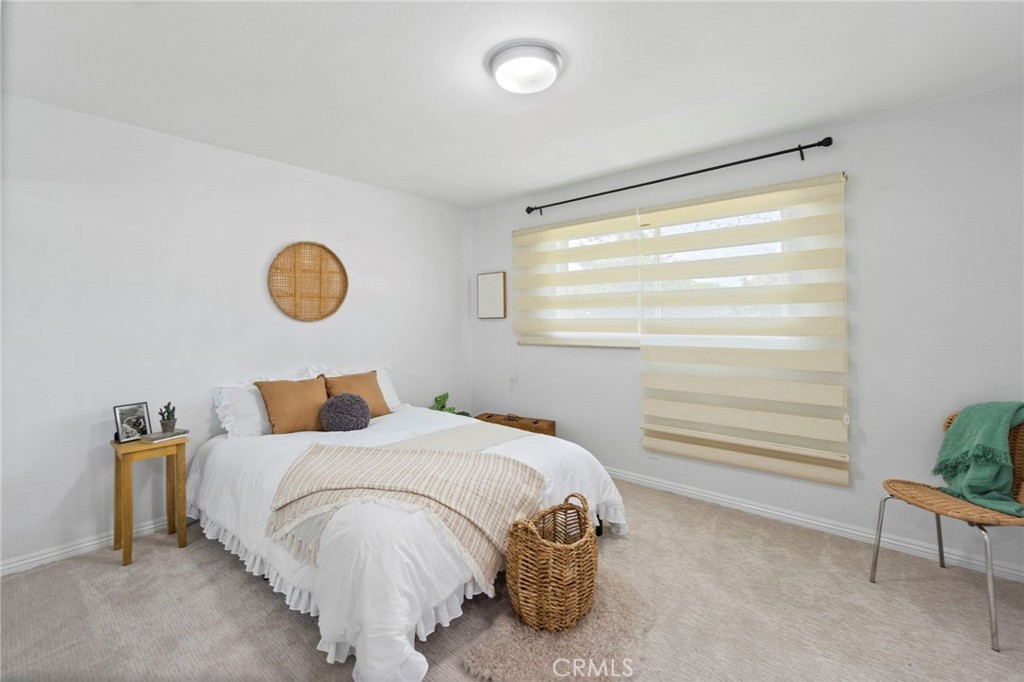 6212 Santa Rita Avenue Garden Grove, CA 92845 - Photo 32 of 50 a bedroom with a bed and chair