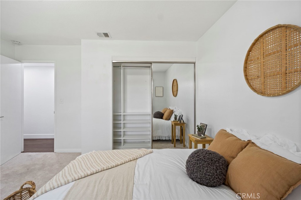 6212 Santa Rita Avenue Garden Grove, CA 92845 - Photo 34 of 50 a bedroom with a bed and a mirror