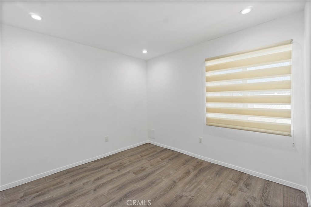 6212 Santa Rita Avenue Garden Grove, CA 92845 - Photo 42 of 50 a view of empty room with wooden floor and fan