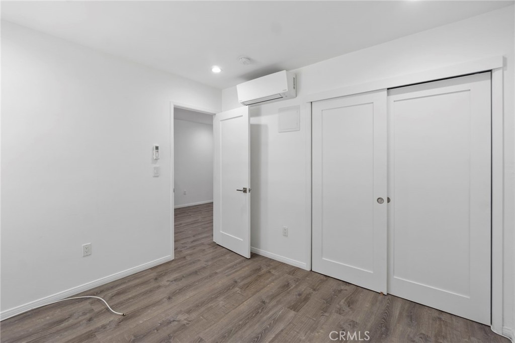 6212 Santa Rita Avenue Garden Grove, CA 92845 - Photo 43 of 50 a view of an empty room with wooden floor