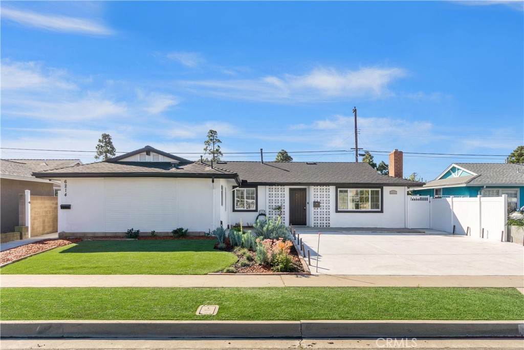 6212 Santa Rita Avenue Garden Grove, CA 92845 - Photo 50 of 50 a front view of a house with a garden and yard