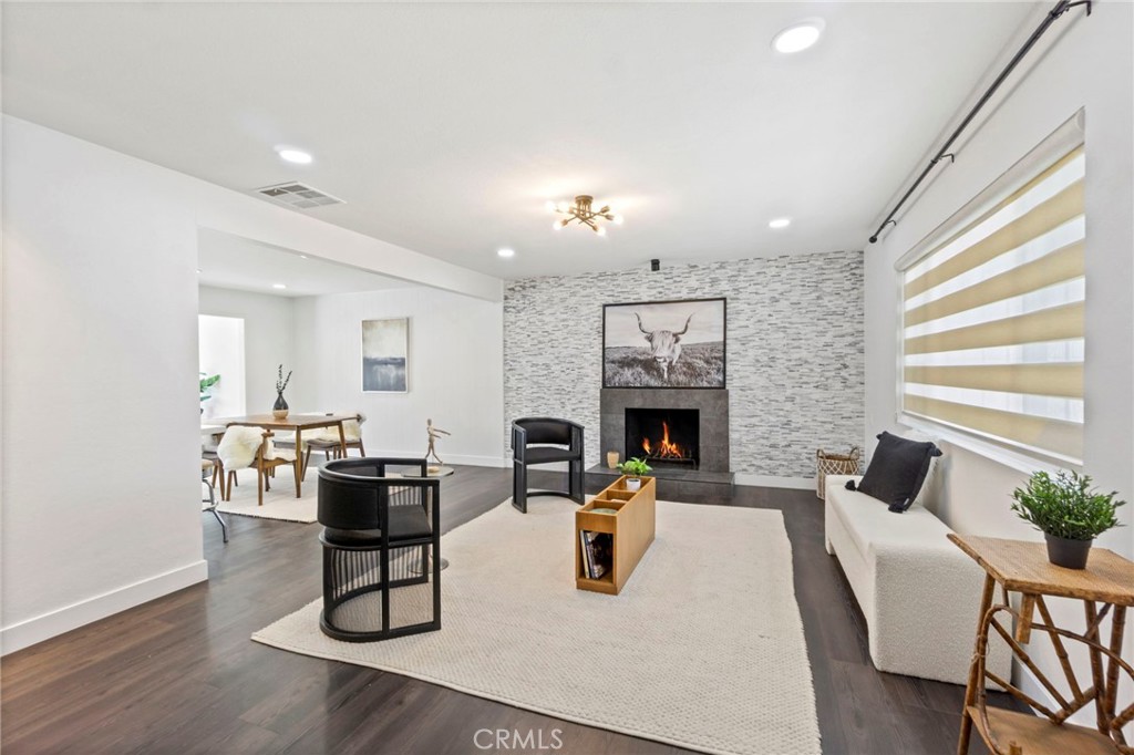 6212 Santa Rita Avenue Garden Grove, CA 92845 - Photo 6 of 50 a living room with furniture a fireplace and a flat screen tv