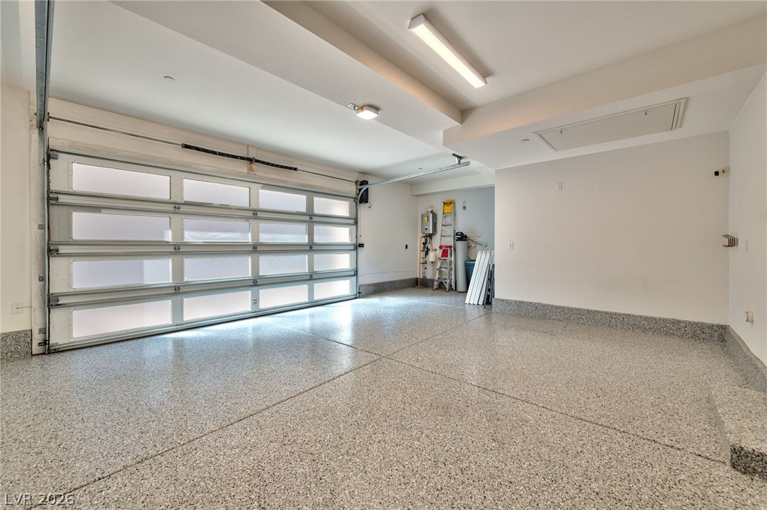 3327 Esker Rdg Avenue Henderson, NV 89044 - Photo 20 of 24 Ample parking and storage await in this bright, clean garage featuring an epoxy-coated floor.