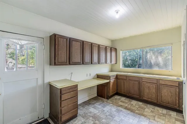 a kitchen with sink and window