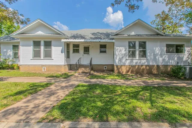 front view of a house with a yard
