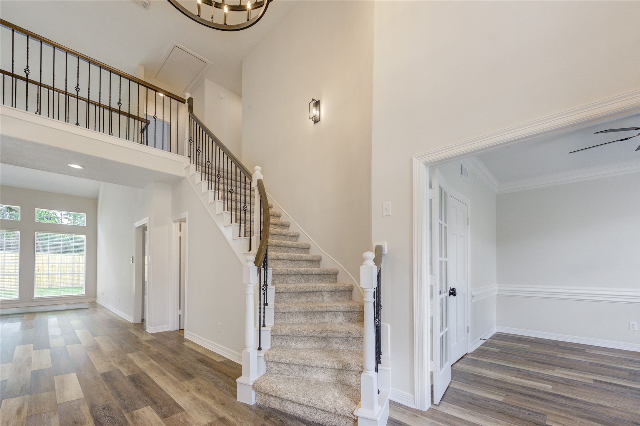 17318 Bonnard Circle Spring, TX 77379 - Photo 6 of 45 The front staircase has new iron balusters. Downstairs has all new flooring while upstairs has all new carpeting and padding.