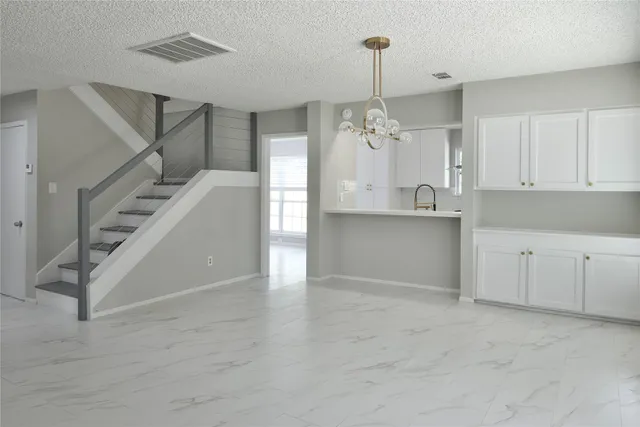 a kitchen with a sink and cabinets