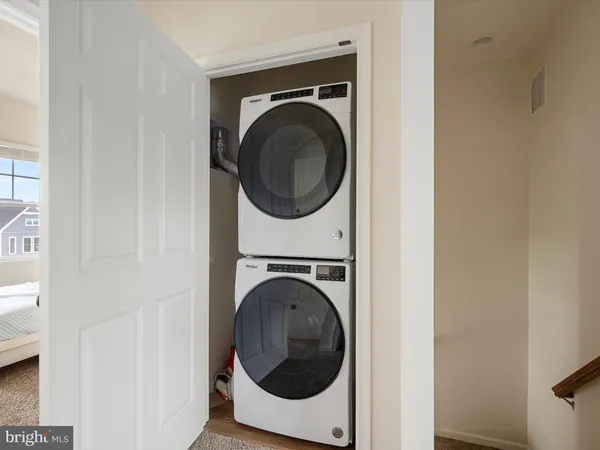 a view of a hallway with washer and dryer