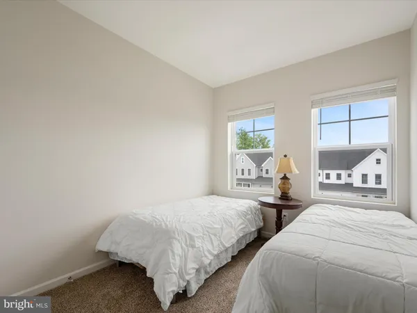 a bedroom with bed and window