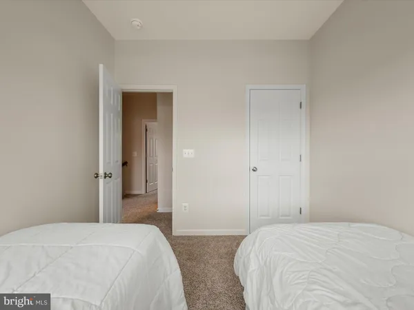 a bedroom with a bed and closet