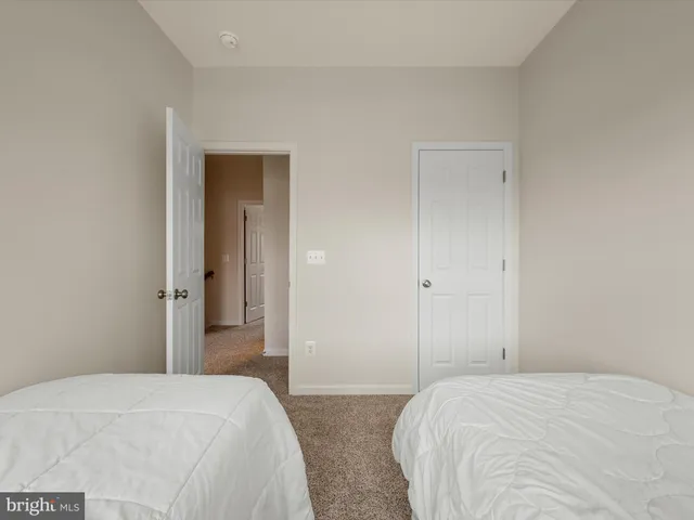 a bedroom with a bed and closet