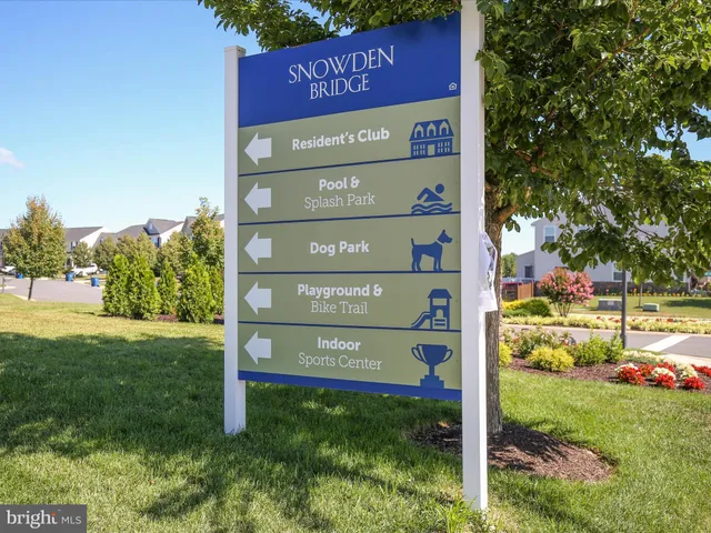 an aerial view of a house with swimming pool patio and outdoor seating