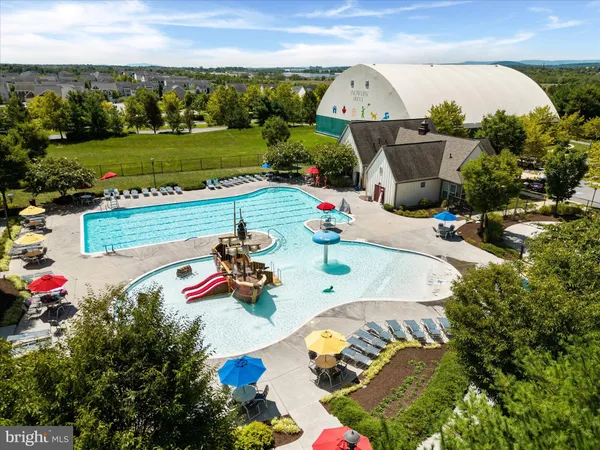 a picture of a bench in front of a wall