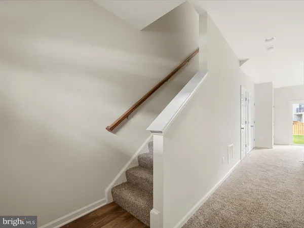 a view of a hallway with staircase