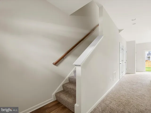 a view of a hallway with staircase