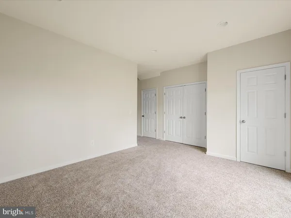a view of an empty room and entryway